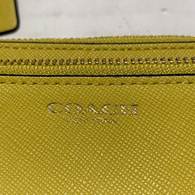 COACH(コーチ)のコーチ リストレット美品  - イエロー レディースのファッション小物(ポーチ)の商品写真