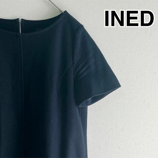 INED(イネド)のINED 半袖 膝丈 ワンピース ウール ビッグポケット 黒 秋冬 13号 美品 レディースのワンピース(ひざ丈ワンピース)の商品写真