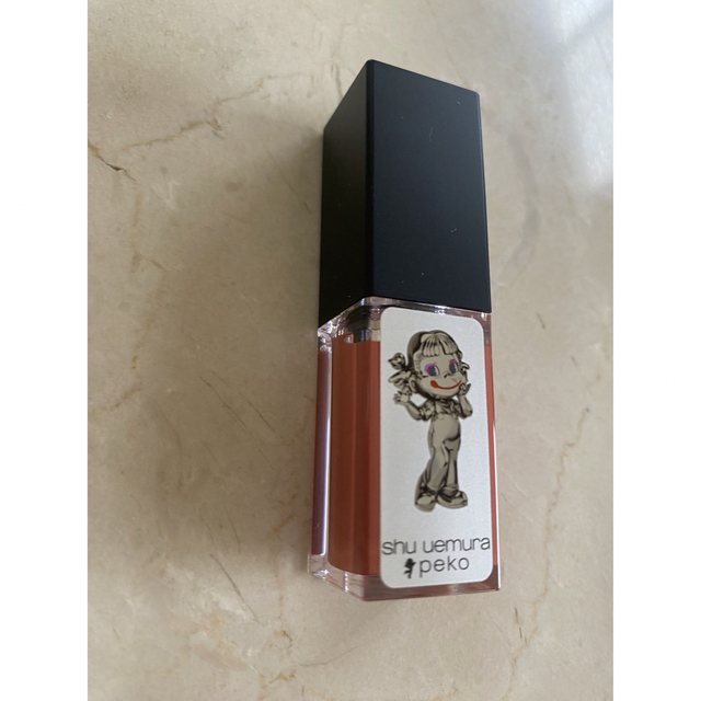 shu uemura(シュウウエムラ)のシュウウエムラ　ペコ　ルージュ アンリミテッド キヌ クリームオレンジガムボール コスメ/美容のベースメイク/化粧品(口紅)の商品写真