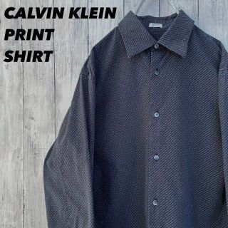 カルバンクライン(Calvin Klein)のアメリカ古着CALVIN KLEINカルバンクライン　総柄プリントシャツ　S 黒(シャツ)