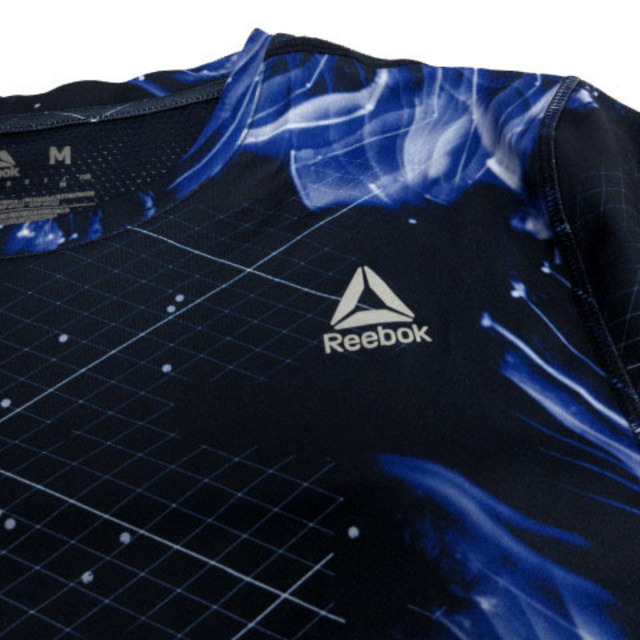 Reebok(リーボック)のReebok Tシャツ 半袖 メッシュ切替え ロゴ 速乾 総柄 紺 青 白 M スポーツ/アウトドアのスポーツ/アウトドア その他(その他)の商品写真