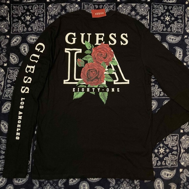 GUESS(ゲス)のLA限定 激レア新品 GUESS 薔薇 ロンT ゲス 長袖Tシャツ 黒 L バラ メンズのトップス(Tシャツ/カットソー(七分/長袖))の商品写真