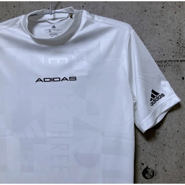 adidas(アディダス)のアディダスゴルフ【O】エンボスプリント 半袖モックネックシャツ（白） スポーツ/アウトドアのゴルフ(ウエア)の商品写真