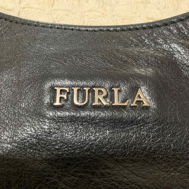 Furla(フルラ)のFURLA  フルラ　黒のリボンハンドバッグ レディースのバッグ(ハンドバッグ)の商品写真