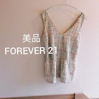 フォーエバートゥエンティーワン(FOREVER 21)のバックデザイン 背中空き リボン ブラウス ノースリーブ タンクトップ 白 柄(シャツ/ブラウス(半袖/袖なし))