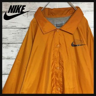 ナイキ(NIKE)の【ビッグサイズ】ナイキ☆ロゴ入りナイロンジャケット　オレンジ 90s　F168(ナイロンジャケット)