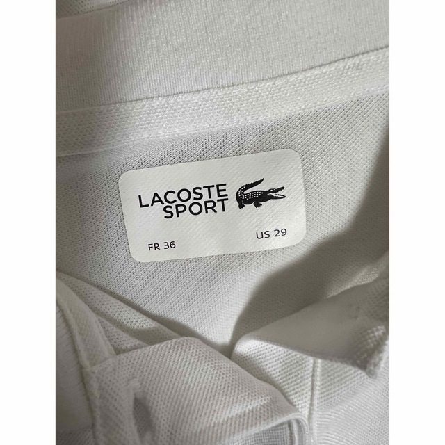 LACOSTE(ラコステ)のラコステ　ポロシャツ　白　Mサイズ レディースのトップス(ポロシャツ)の商品写真