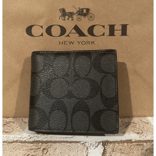 COACH(コーチ)のcoach  シグネチャーブラック　折財布　黒　プレゼント　メンズ メンズのファッション小物(折り財布)の商品写真