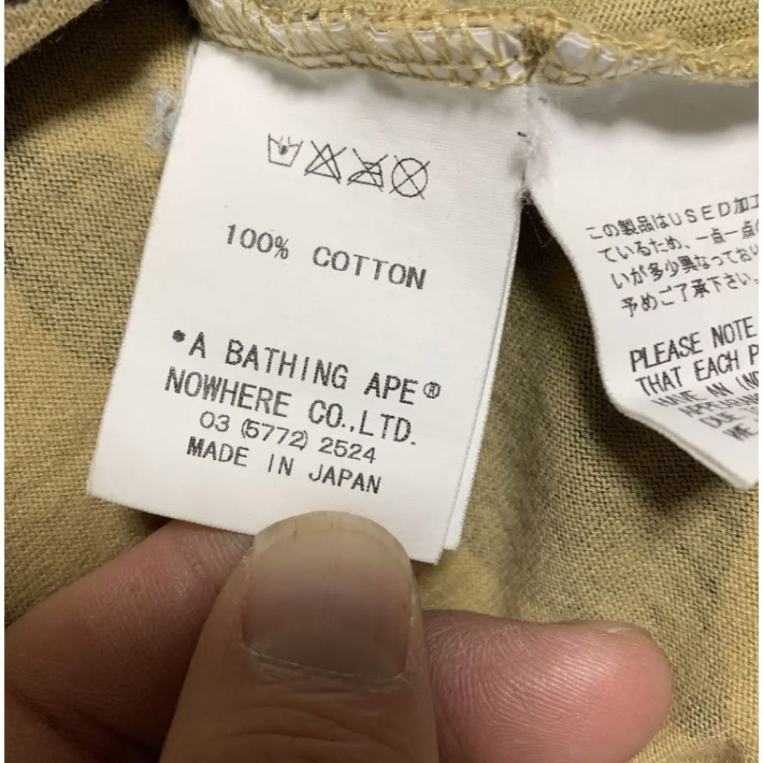 A BATHING APE(アベイシングエイプ)の激レア!!A BATHING APE ×KAWS 総柄カモフラ Tシャツ メンズのトップス(Tシャツ/カットソー(半袖/袖なし))の商品写真