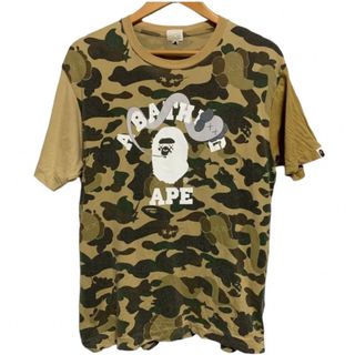 アベイシングエイプ(A BATHING APE)の激レア!!A BATHING APE ×KAWS 総柄カモフラ Tシャツ(Tシャツ/カットソー(半袖/袖なし))