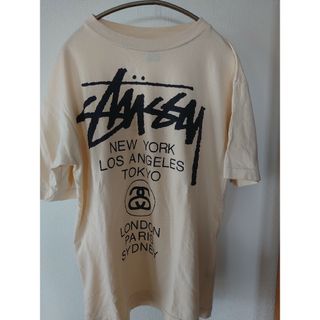 ステューシー(STUSSY)のSTUSSY　Tシャツ　ベージュ　ワールドツアー(Tシャツ/カットソー(半袖/袖なし))