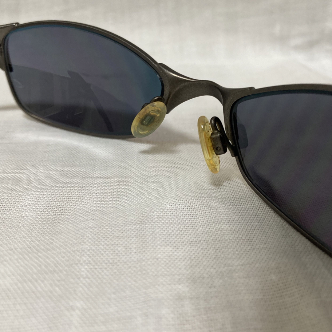 Oakley(オークリー)のoakley サングラス　ワイヤータップ　USED品 メンズのファッション小物(サングラス/メガネ)の商品写真