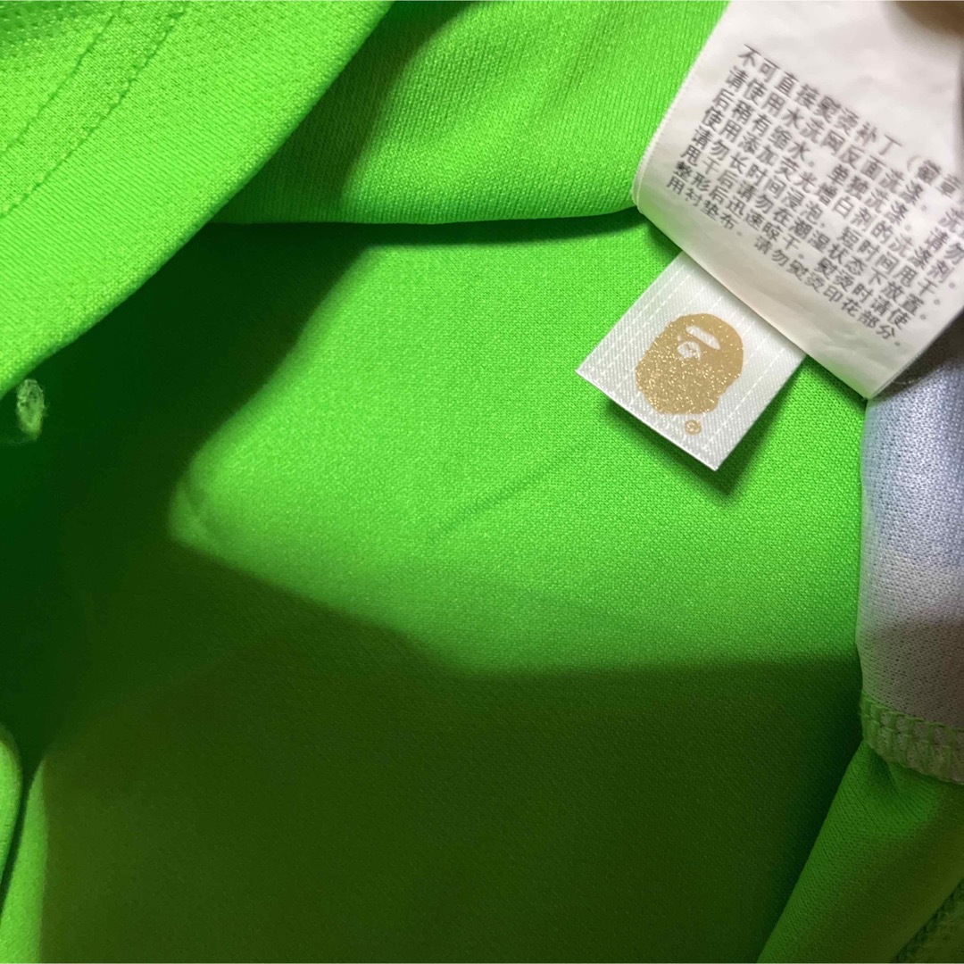 A BATHING APE(アベイシングエイプ)のAPE BAPE  KAWS 1st CAMO 迷彩　ポロシャツ　tシャツ　M メンズのトップス(ポロシャツ)の商品写真