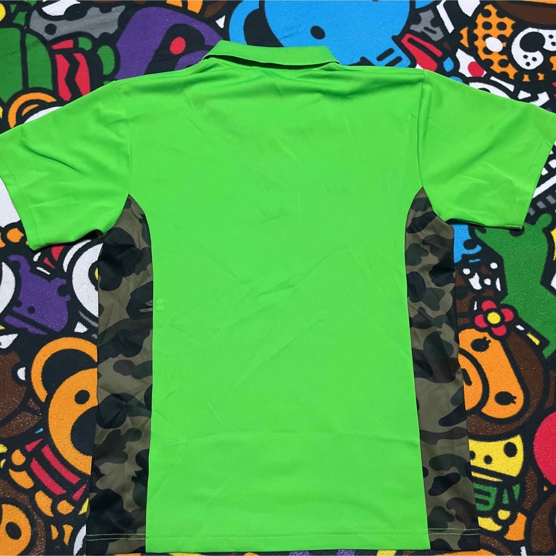 A BATHING APE(アベイシングエイプ)のAPE BAPE  KAWS 1st CAMO 迷彩　ポロシャツ　tシャツ　M メンズのトップス(ポロシャツ)の商品写真