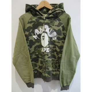 アベイシングエイプ(A BATHING APE)の[U5744]アベイシングエイプ KAWS パーカー 迷彩柄 Mサイズ(パーカー)