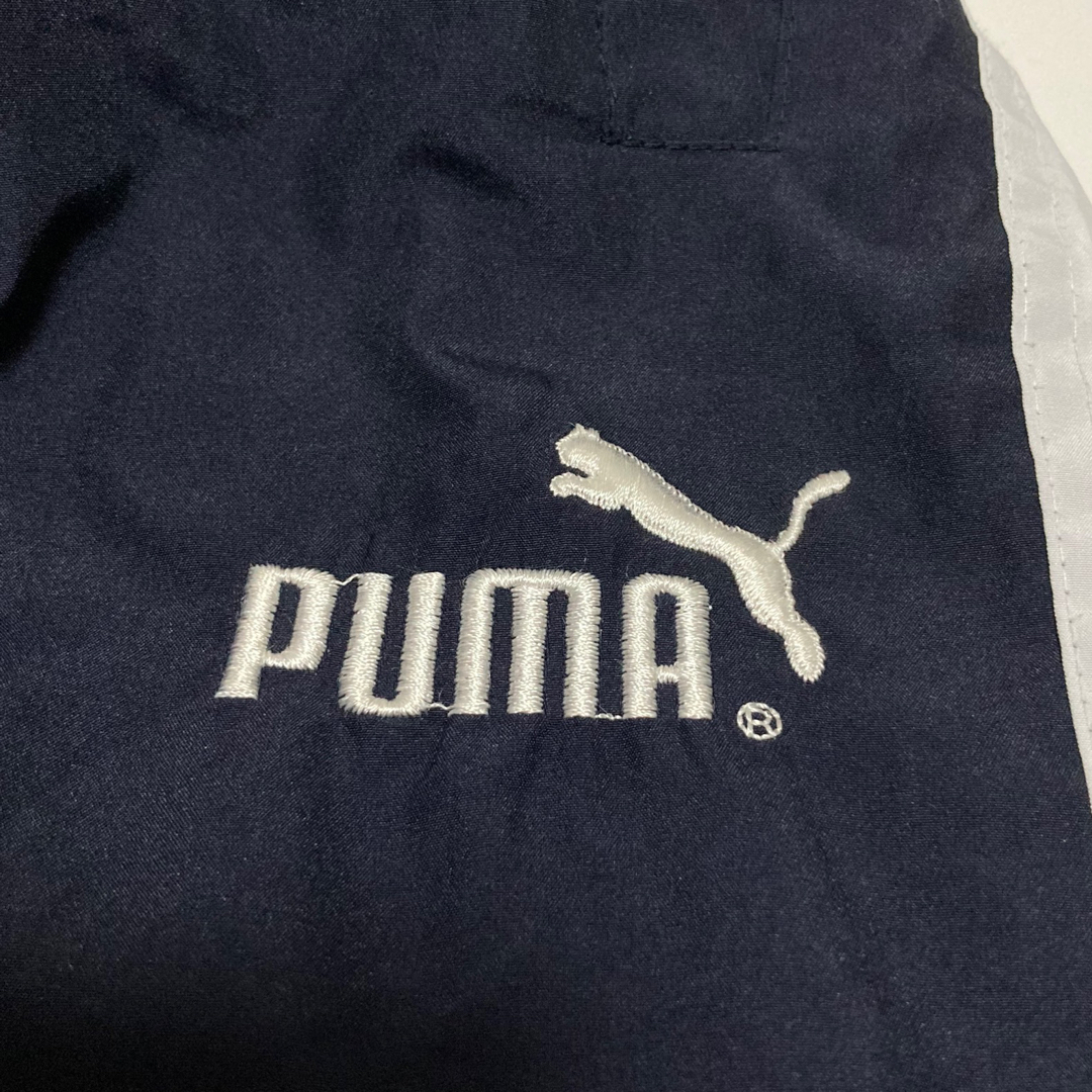 PUMA(プーマ)の90s PUMA ナイロンパンツ プーマ 万国旗タグ トラックパンツ ビンテージ メンズのパンツ(その他)の商品写真