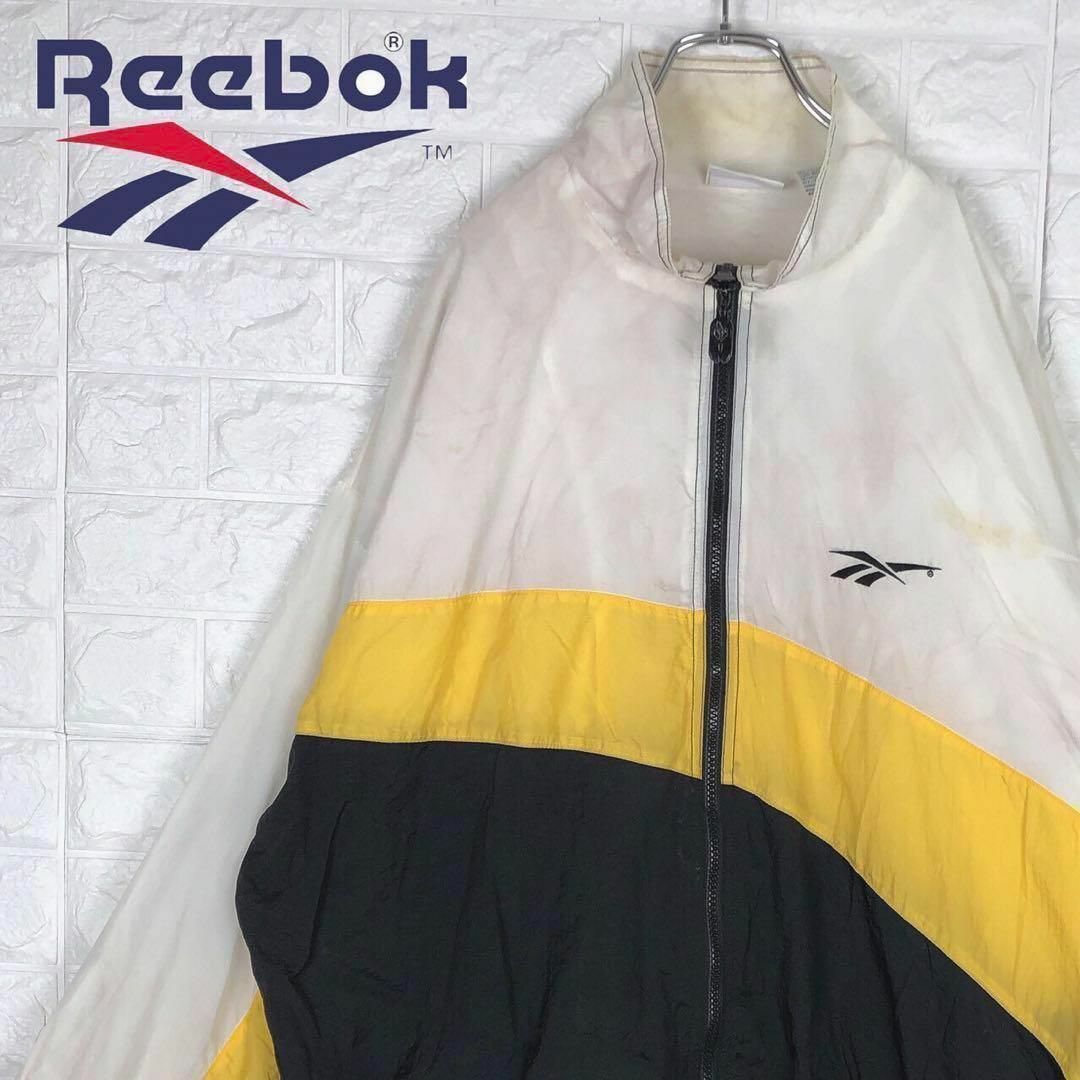 Reebok(リーボック)のリーボック マルチカラーナイロンジャケット バックデカロゴ オーバーサイズ メンズのジャケット/アウター(ナイロンジャケット)の商品写真