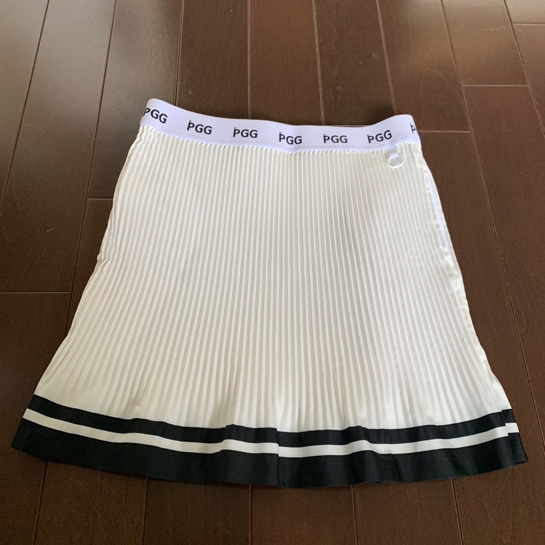 パーリーゲイツPGG白プリーツスカートとモックトップスセットアップサイズ1