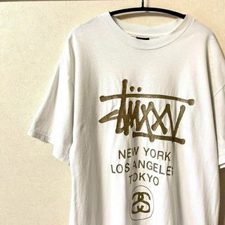 ステューシー Tシャツ・カットソー(メンズ)（ゴールド/金色系）の通販