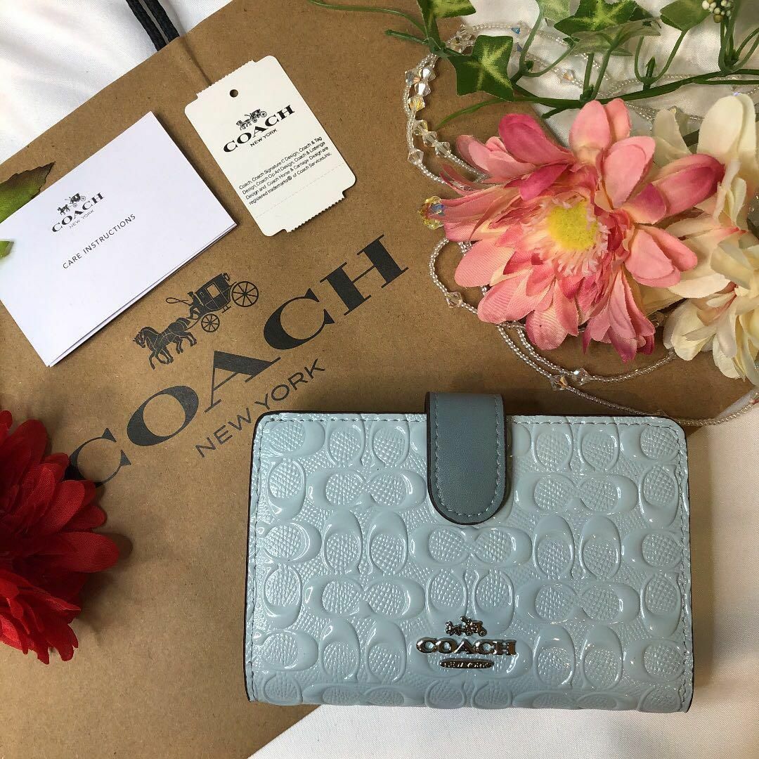 COACH コーチ 二つ折り財布 エンボス シグネチャー スカイブルー - 財布