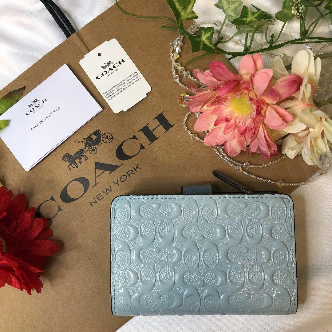 COACH コーチ 二つ折り 水色 エンボス シグネチャー