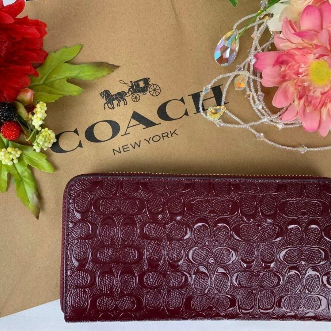 COACH ピンク エンボス エンジ-