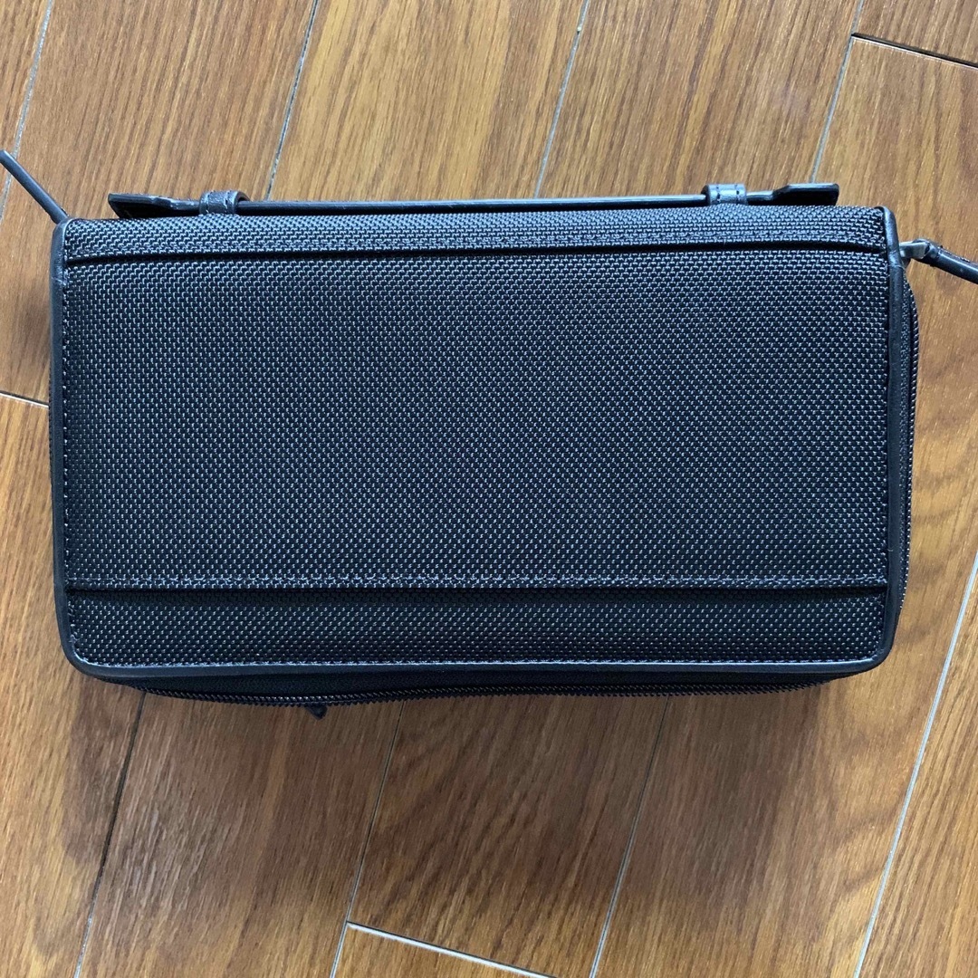 TUMI DOUBLE ZIP AROUND CLUTCH BLACK TUMI DOUBLE ZIP AROUND CLUTCH BLACK