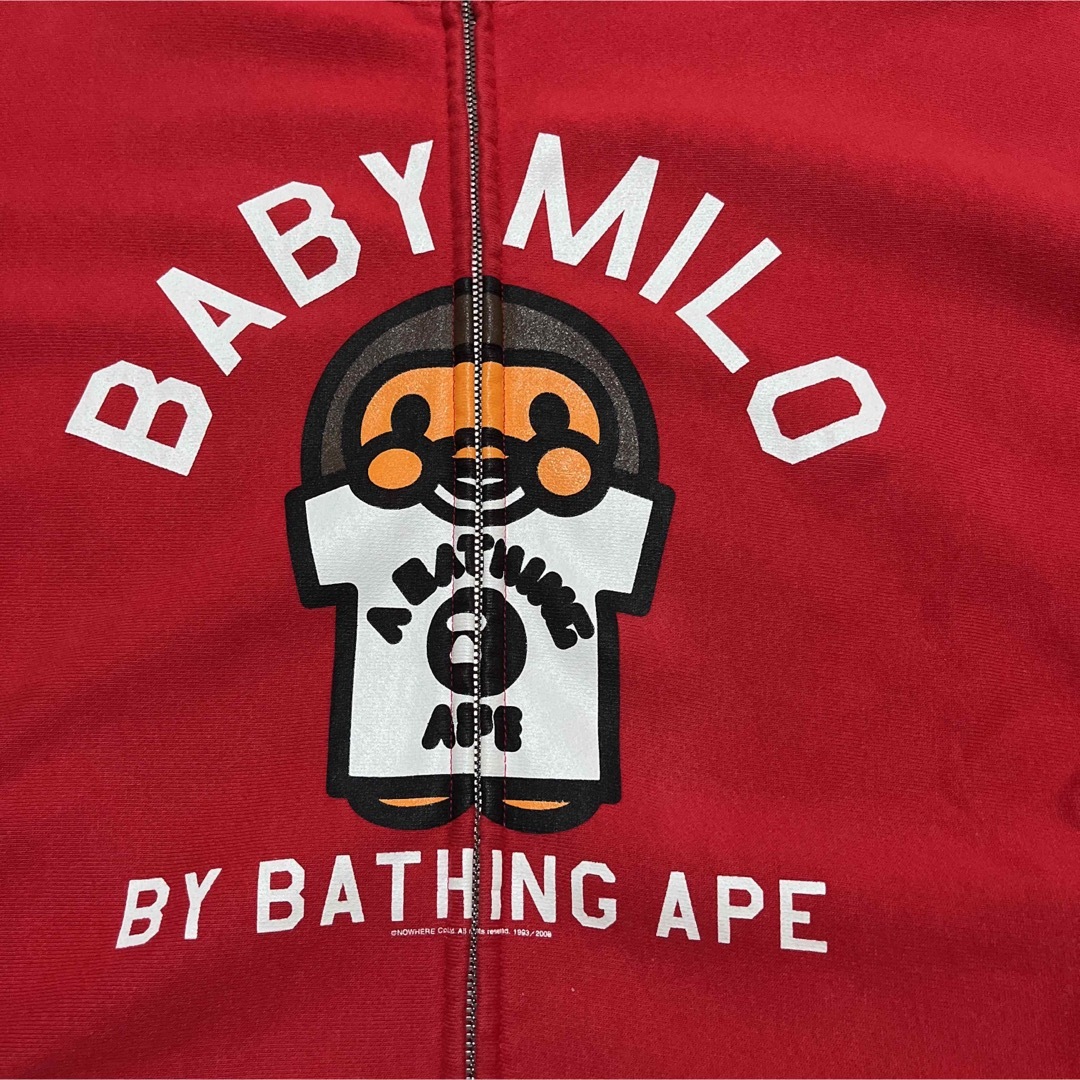 A BATHING APE(アベイシングエイプ)のAPE BAPE KAWS BABY MILO パーカー　ベビーマイロ　M 赤 メンズのトップス(パーカー)の商品写真