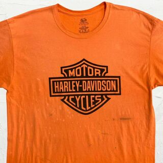 ハーレーダビッドソン(Harley Davidson)のMGA  Tシャツ 古着   オレンジ ハーレーダビッドソン　ロゴ　バイク(Tシャツ/カットソー(半袖/袖なし))