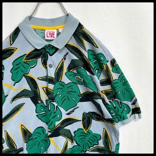 ラコステ(LACOSTE)の【入手困難】ラコステライブ　ボタニカル　総柄　鹿の子　半袖ポロシャツ　ブルー(ポロシャツ)