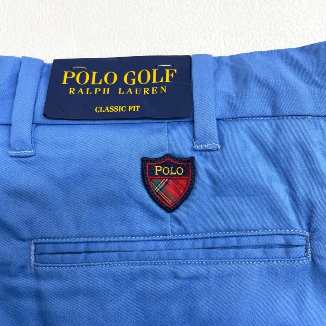 Ralph Lauren(ラルフローレン)のDeadstock ポロ ゴルフ ラルフローレン POLO GOLF RALPH LAUREN チノ ショートパンツ ノータック ワンポイント ロゴ ワッペン ひざ丈 ワイド ストレッチ GOLF CLASSIC FIT サイズ：W38 ライトブルー  【新古品】 メンズのスーツ(スラックス/スーツパンツ)の商品写真