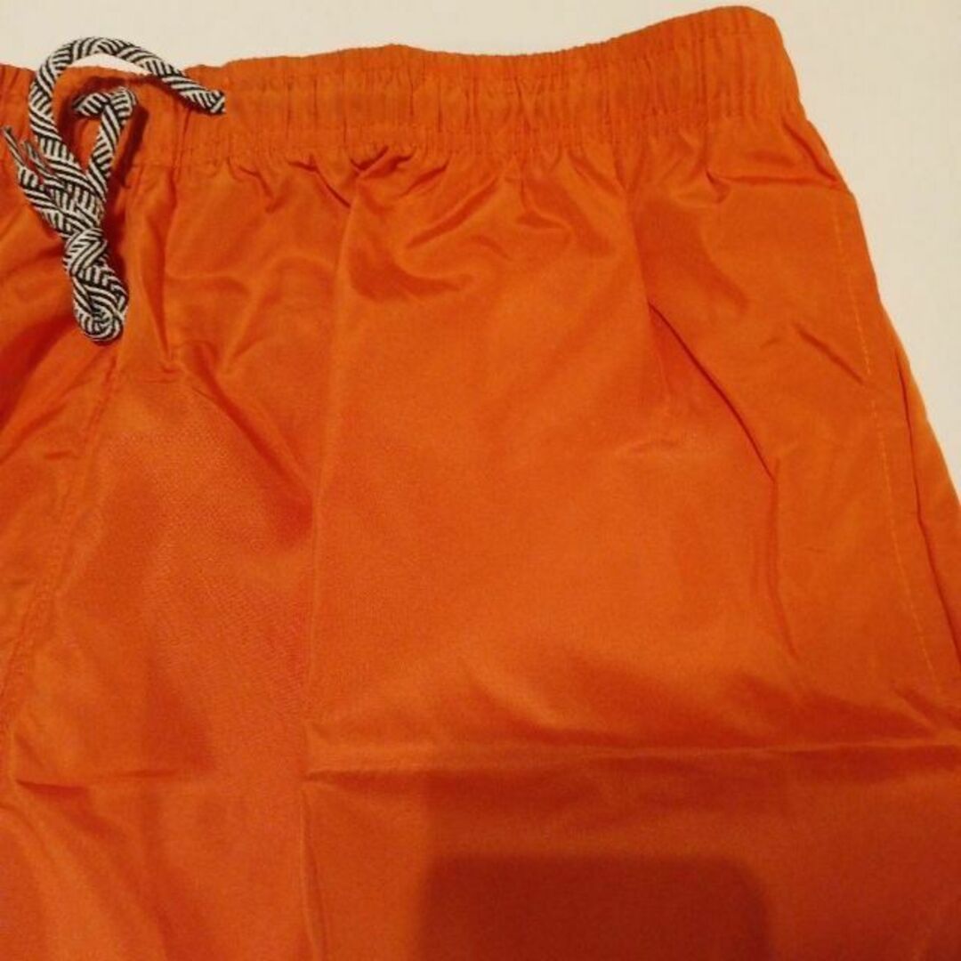 オレンジハーフパンツ　ショートパンツ　水着　水陸両用　速乾　メンズ　ビーチパンツ メンズのパンツ(ショートパンツ)の商品写真