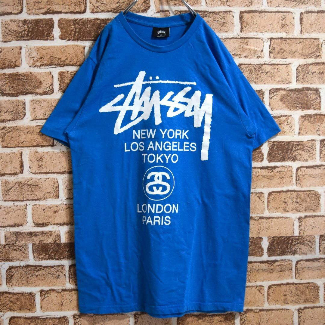 本日超得 《ステューシー》ビッグロゴ ライトブルー ワールドツアー M