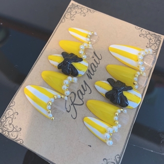 No.164 スキニーオーバル　黄色　リボン　ストライプ　ネイルチップ ハンドメイドのアクセサリー(ネイルチップ)の商品写真