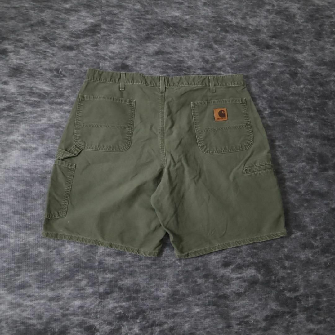 carhartt(カーハート)の【カーハート】革ロゴ ダック地 ルーズ ワイド ペインター ショーツ 緑 W40 メンズのパンツ(ペインターパンツ)の商品写真