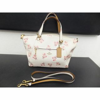 コーチ(COACH)のコーチ サッチェル ウィズ フローラル ボウ プリント レザー 花柄バッグ(ハンドバッグ)