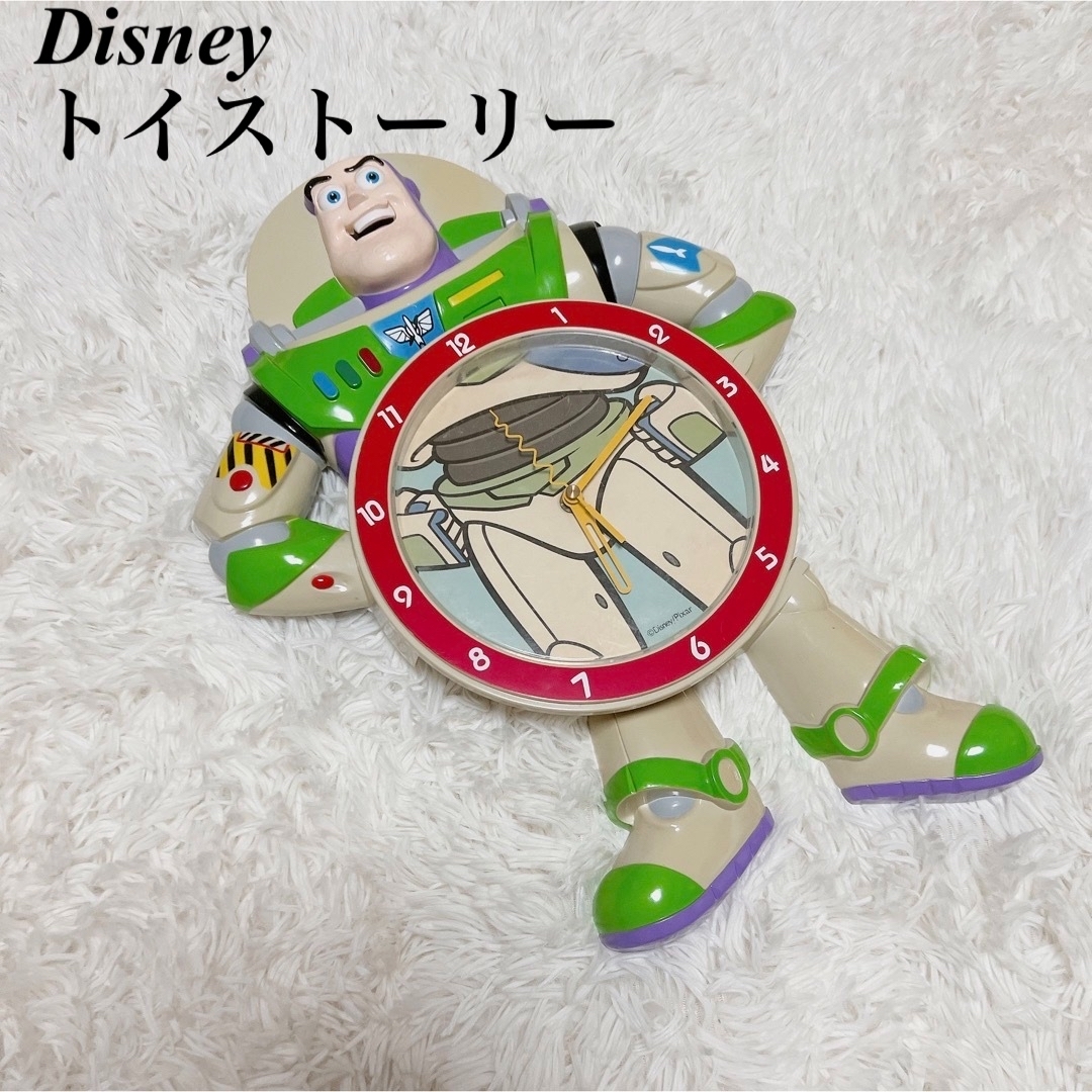 バズライトイヤー 壁掛け時計 トイストーリー 振り子時計 | フリマアプリ ラクマ
