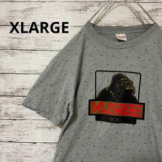 エクストララージ(XLARGE)のXLARGE ロゴTシャツ 総柄 LA ゴリラ グレー ストリート 定番 人気(Tシャツ/カットソー(半袖/袖なし))