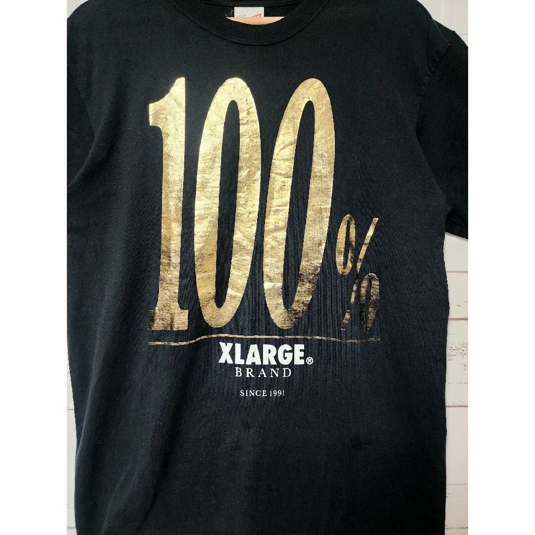 XLARGE(エクストララージ)の《大人気》XLARGE エクストララージ Tシャツ 100%ロゴ 黒 金 L メンズのトップス(Tシャツ/カットソー(半袖/袖なし))の商品写真