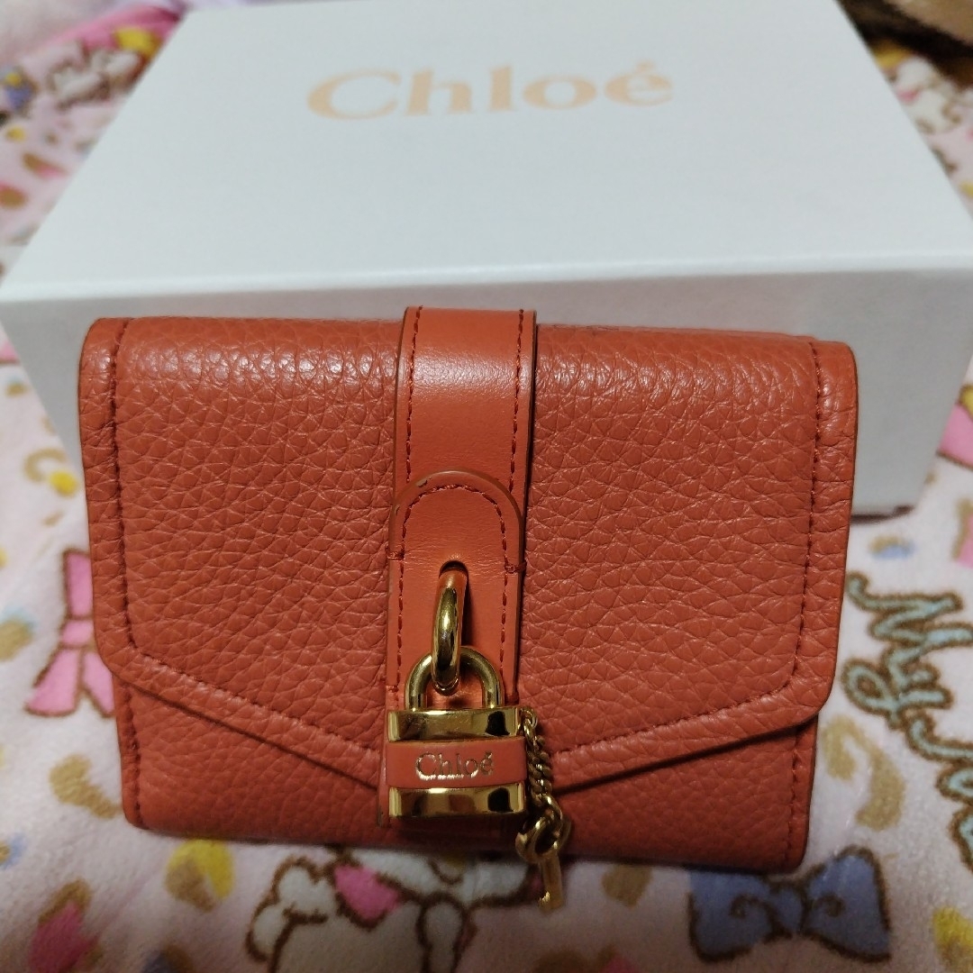 Chloeクロエ財布 南京錠が可愛い 優しめオレンジ系