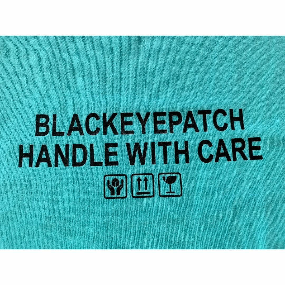 BLACK EYE PATCH HANDLE WITH CARE TEE