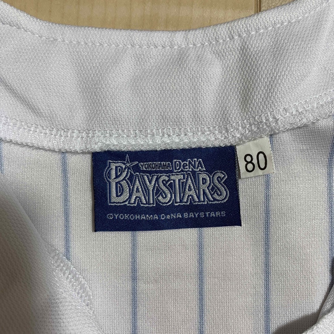 横浜DeNAベイスターズ(ヨコハマディーエヌエーベイスターズ)のベイスターズ　ユニフォーム　80センチ　ベビー　BAYSTARS スポーツ/アウトドアの野球(応援グッズ)の商品写真