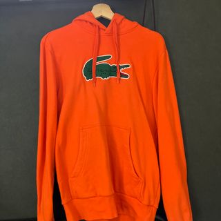 ラコステ(LACOSTE)のLACOSTE パーカー オレンジ(パーカー)