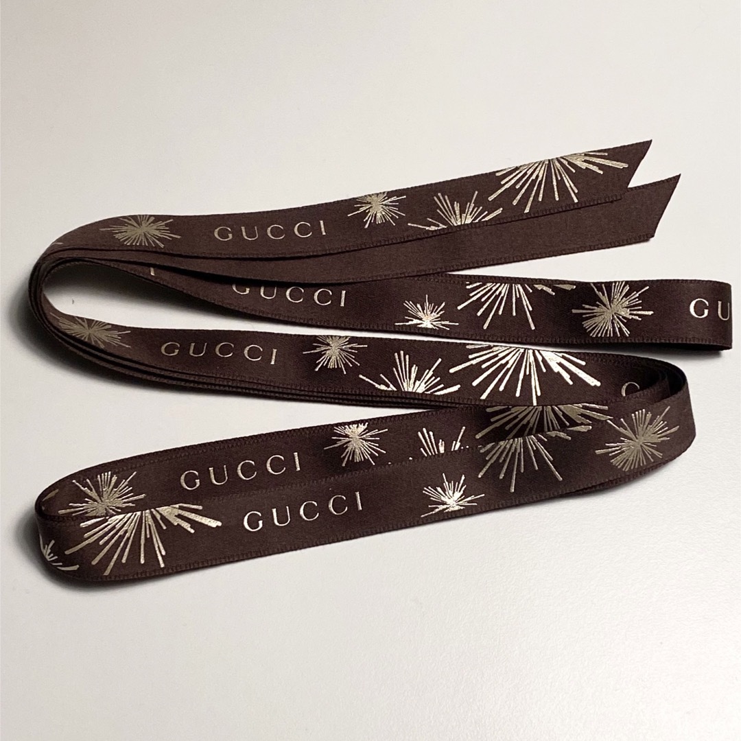 Gucci(グッチ)のGUCCI グッチ  限定 リボン  ブラウン 花火柄 210cm  美品 インテリア/住まい/日用品のオフィス用品(ラッピング/包装)の商品写真