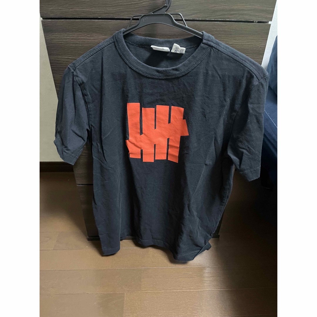 UNDEFEATED(アンディフィーテッド)のUNDEFEATED Tシャツ　オレンジ　ロゴ　チャンピオン メンズのトップス(Tシャツ/カットソー(半袖/袖なし))の商品写真