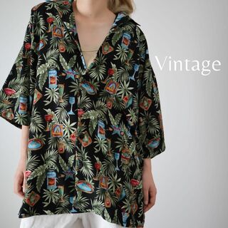 アートヴィンテージ(ART VINTAGE)の【vintage】リカー リーフ パターン 総柄 とろみ 半袖シャツ XL 黒(シャツ)