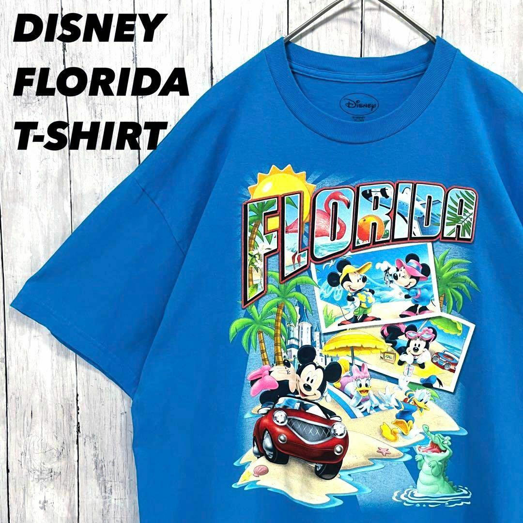 Disney(ディズニー)のアメリカ古着DISNEY FLORIDAディズニーフロリダプリントTシャツ　青 メンズのトップス(Tシャツ/カットソー(半袖/袖なし))の商品写真