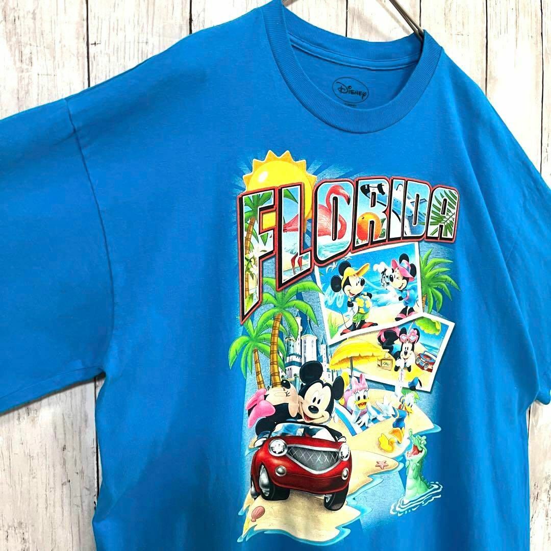 Disney(ディズニー)のアメリカ古着DISNEY FLORIDAディズニーフロリダプリントTシャツ　青 メンズのトップス(Tシャツ/カットソー(半袖/袖なし))の商品写真