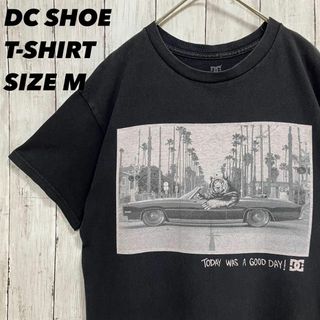 ディーシーシューズ(DC SHOES)のアメリカ古着DC SHOE 熊クラシックカーアートプリントTシャツ　サイズM 黒(Tシャツ/カットソー(半袖/袖なし))