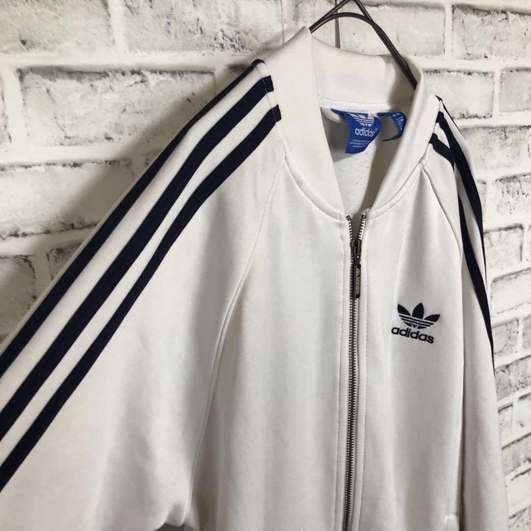 Originals（adidas）(オリジナルス)のXL⭐️ adidas トラックジャケット 刺繍トレファイル 白×ネイビー メンズのトップス(ジャージ)の商品写真